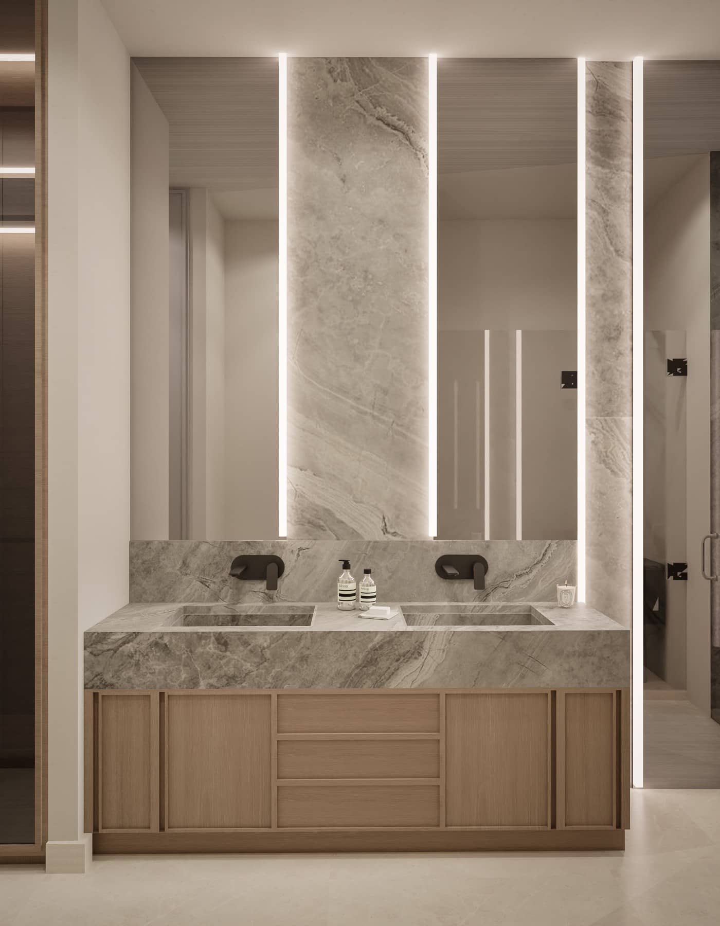 Baño con mármol gris y espejo retroiluminado